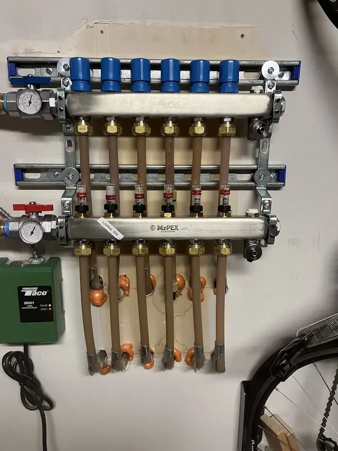 Plumber performing Water Heater Repair at a residential property in Mills